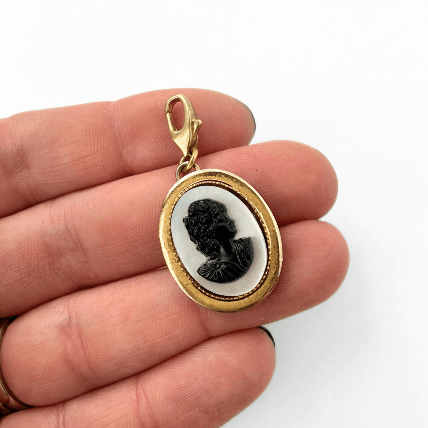 Vintage oval mother of pearl cameo charm with black acrylic and gold plated frame