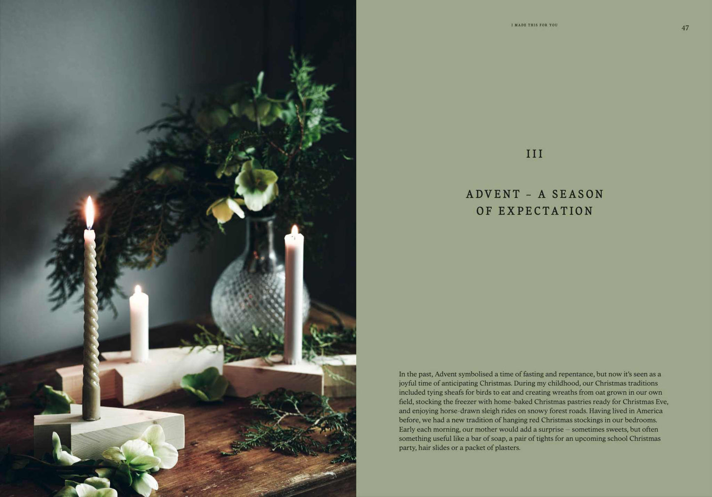 Christmas gift and decorations with handmade candles and greenery on wooden table