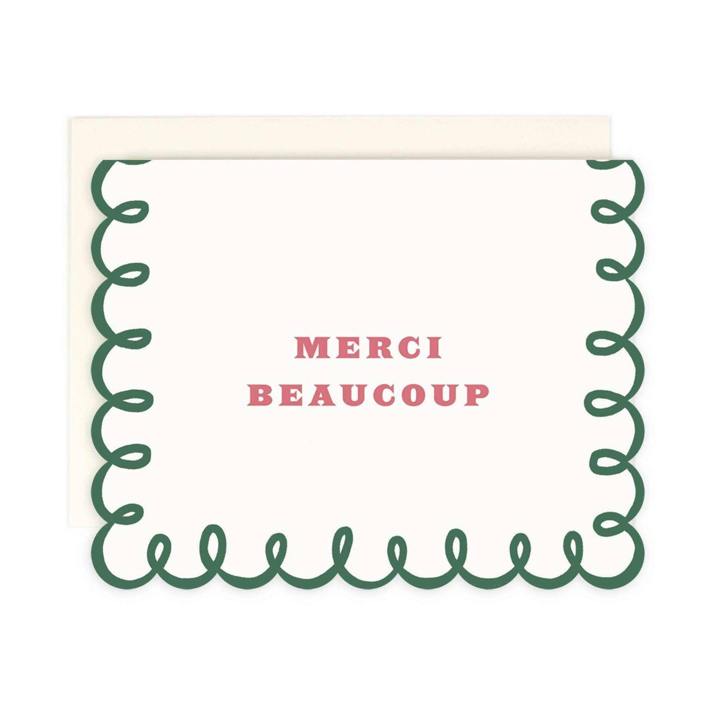 Merci Beaucoup warm white die cut folded card with green border and coordinating envelope