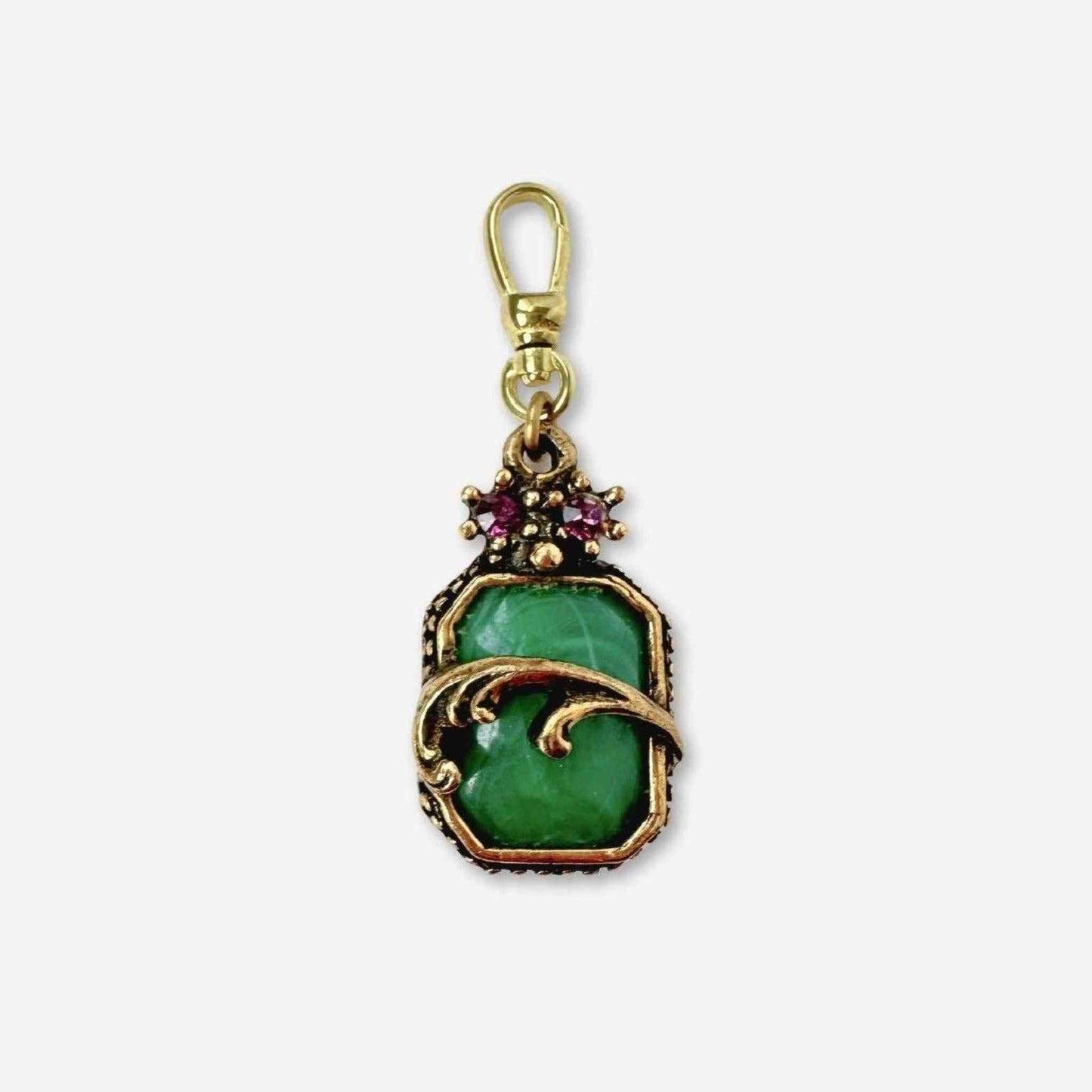 Vintage green cabochon charm in antique brass with purple rhinestone accent and swivel clasp