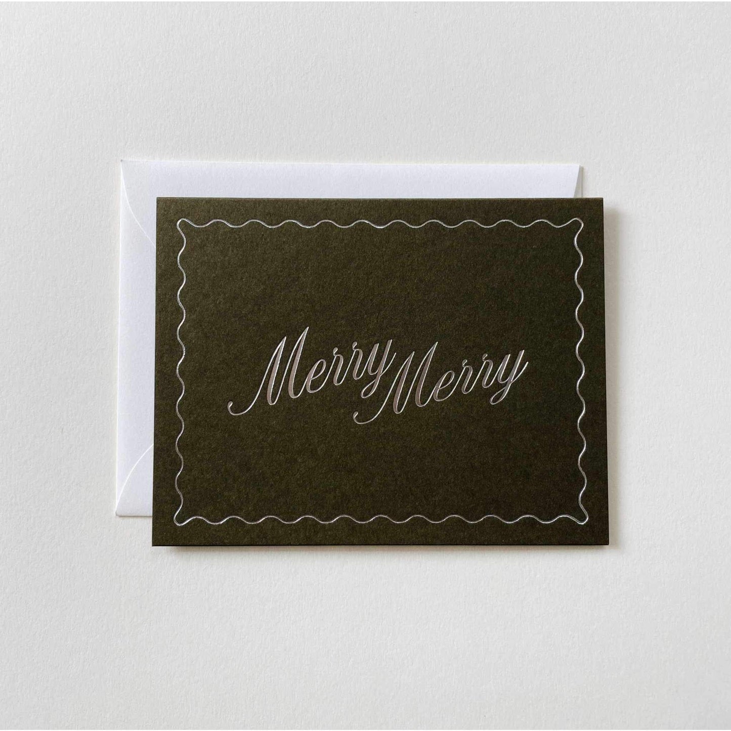 Moss colored folded card with metallic silver "Merry Merry" text and natural envelope