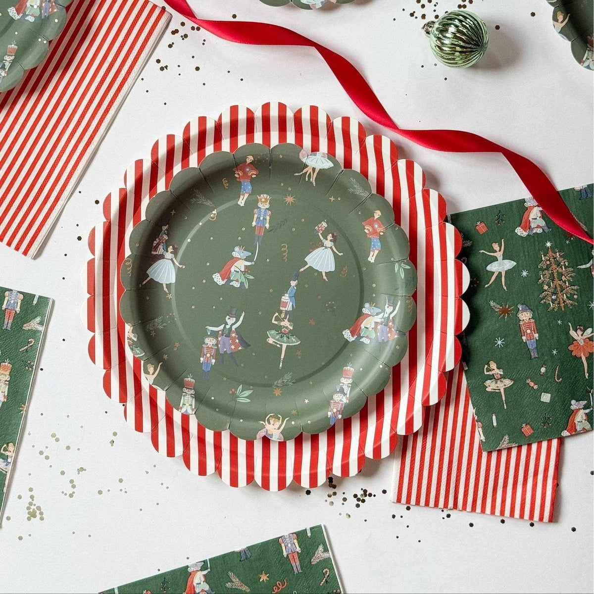 
                  
                    Green Christmas Nutcracker dinner napkins with nutcracker characters and gold-foil accents on dark green background
                  
                
