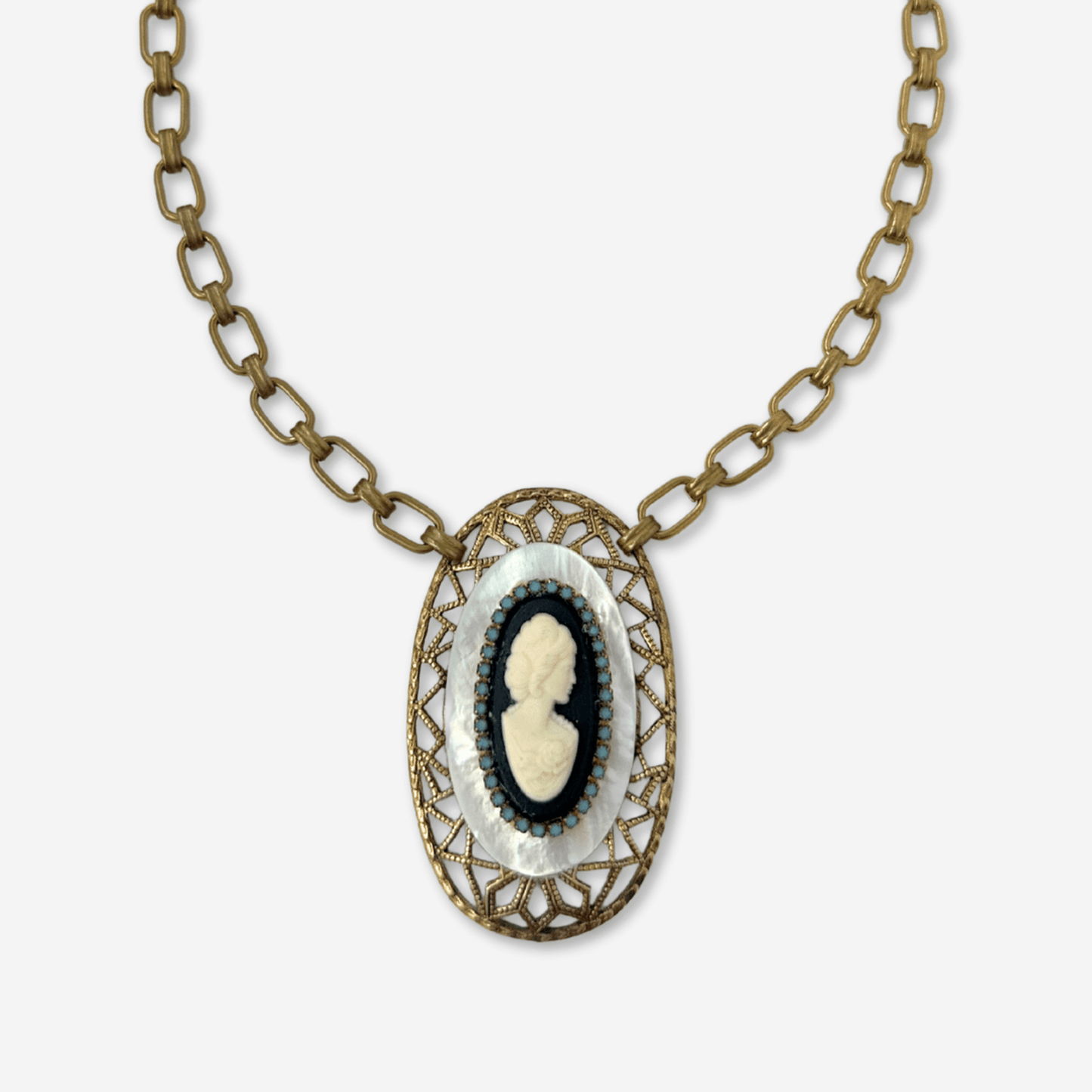 Mother of Pearl vintage cameo pendant necklace with blue opal rhinestones on brass chain