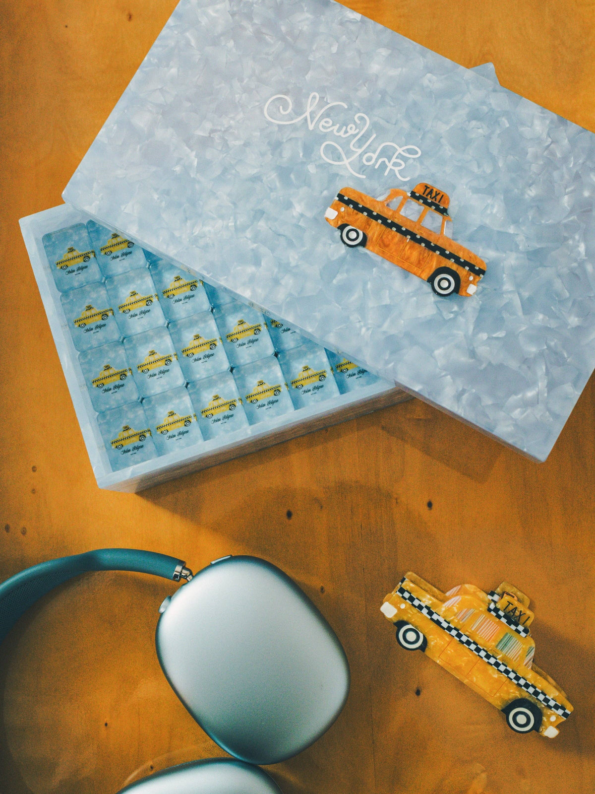 
                  
                    New York mahjong set lid with silver New York script and enamel checker cab
                  
                