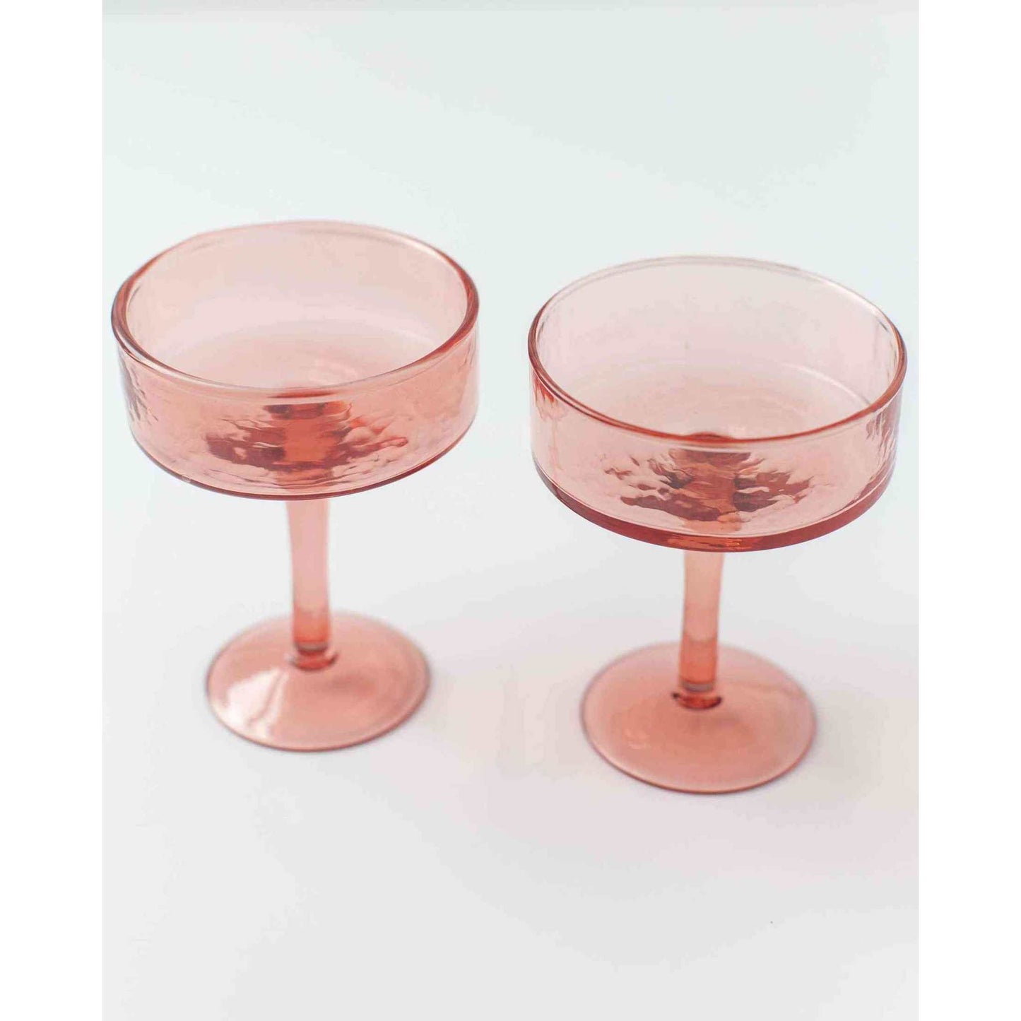 
                  
                    Blush Handblown Hammered Coupe Mixed Beverage Glasses are sold individually. - Curated Home Decor
                  
                