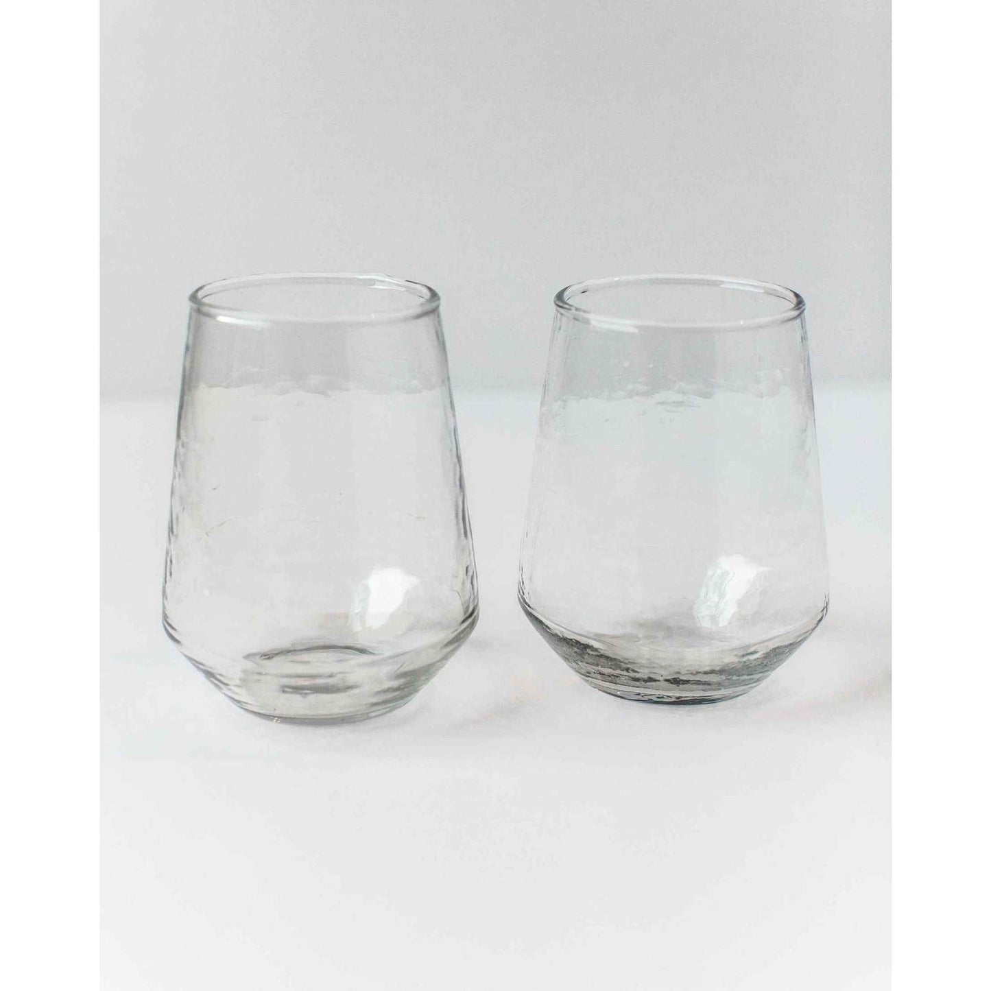 
                  
                    A pair of amber handblown hammered glass water tumblers. - Curated Home Decor
                  
                