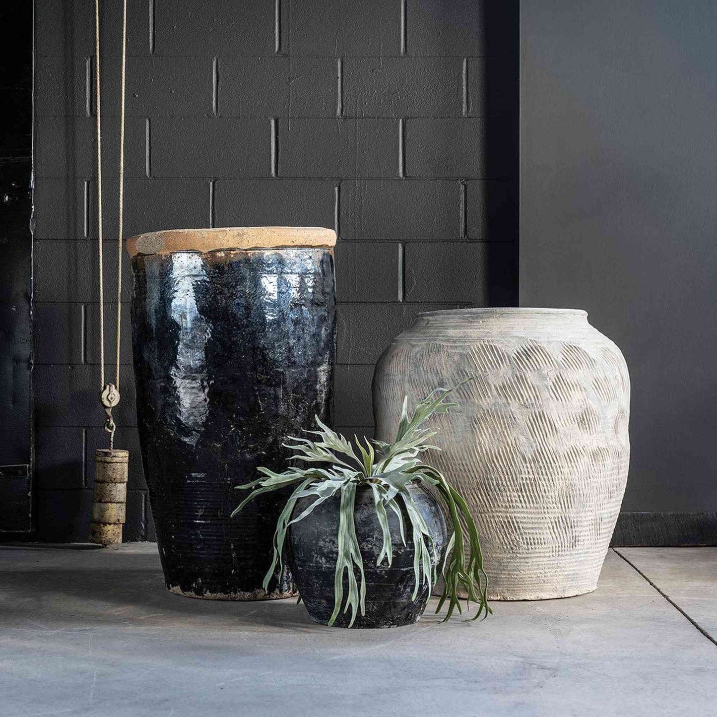 Vintage hand-crafted Cunmin Pot made of clay, used for rice wine fermentation, showcased as rustic decor and planter