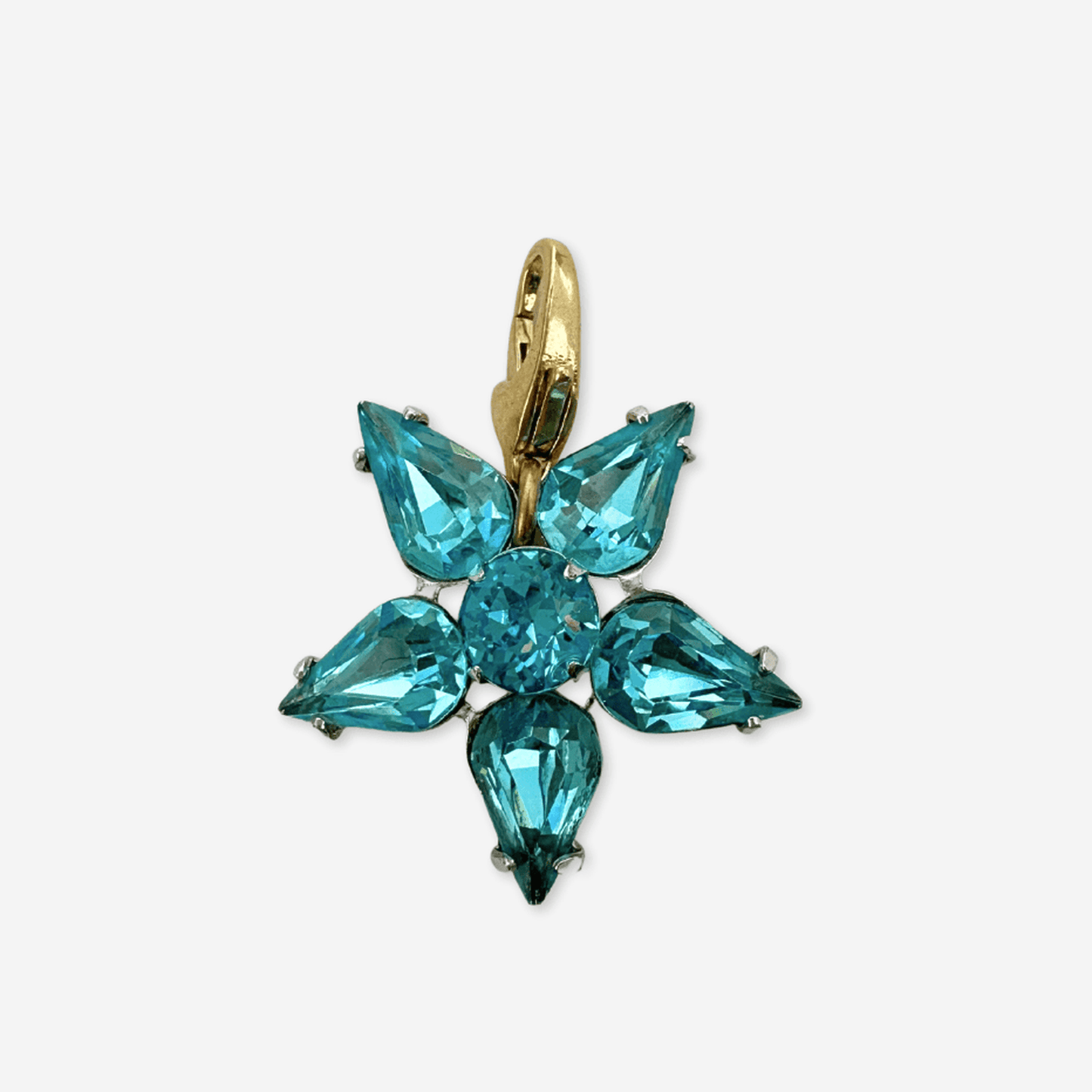 Vintage aqua blue rhinestone star charm with silver-tone setting and brass clasp