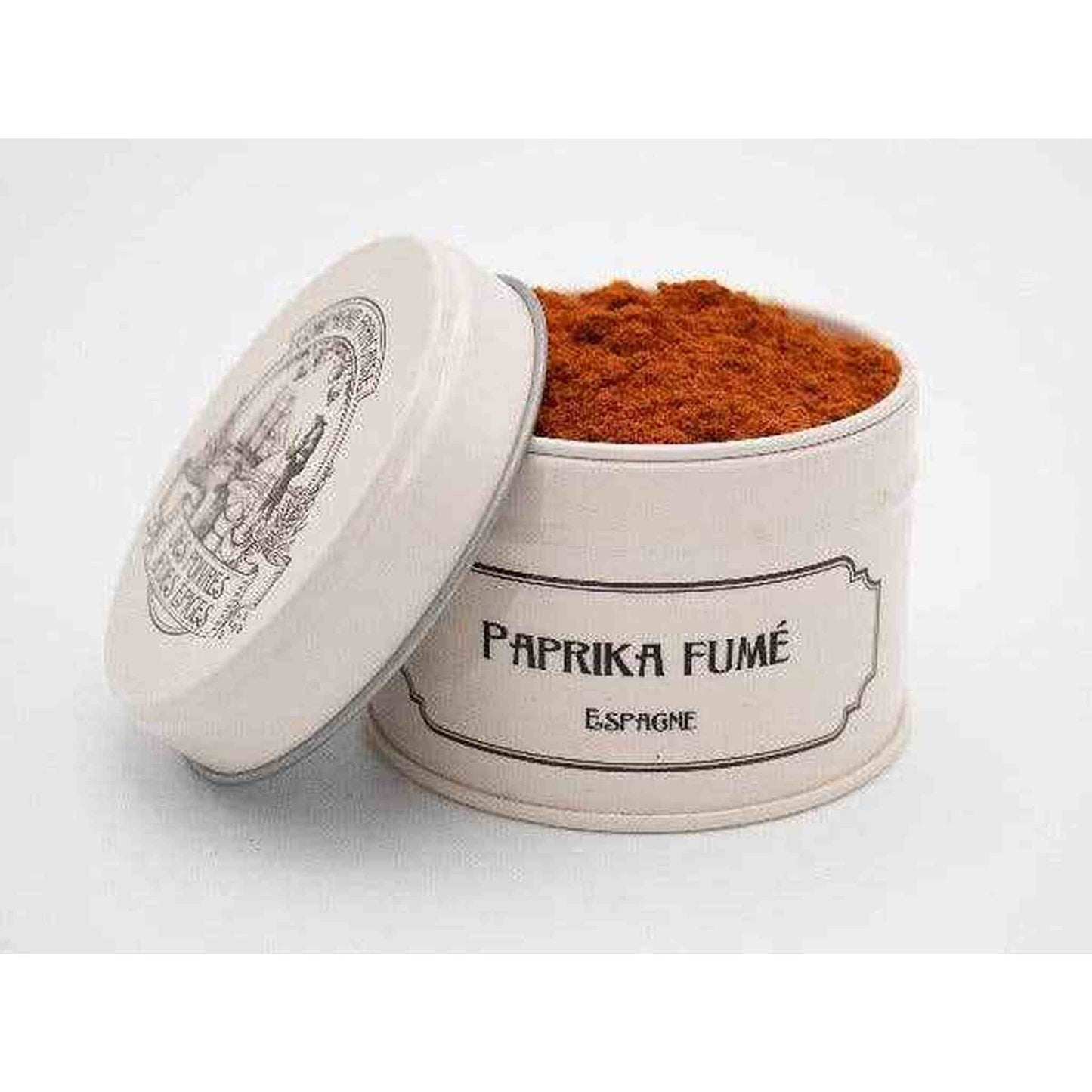 Smoked paprika spice in white ceramic container with lid on white background