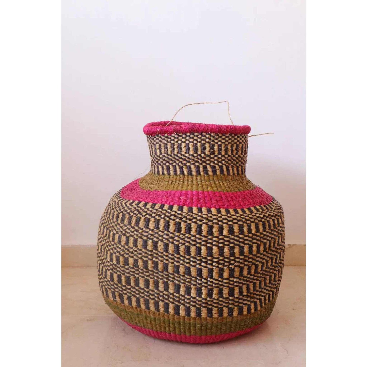 Pink round African decor basket handmade from natural vetiver leaf in Burkina Faso