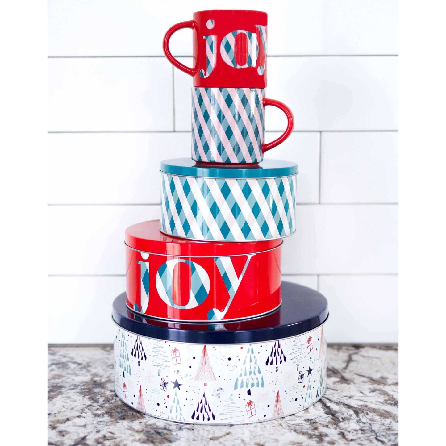 Set of 3 festive cookie tins with tight-sealing lids in various sizes, featuring holiday-themed patterns and "joy" text.