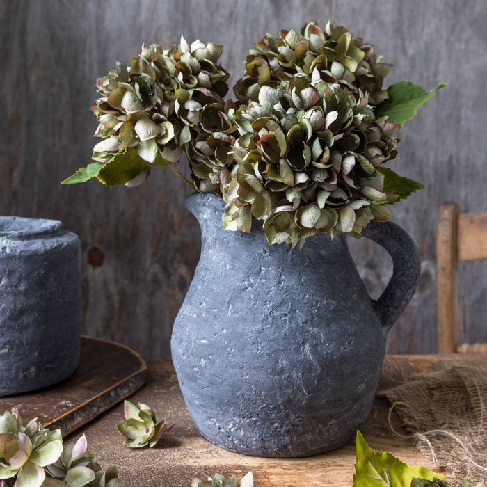 
                  
                    Abigail Ahern Real Touch Hydrangea Chloris stems arranged in a vase
                  
                