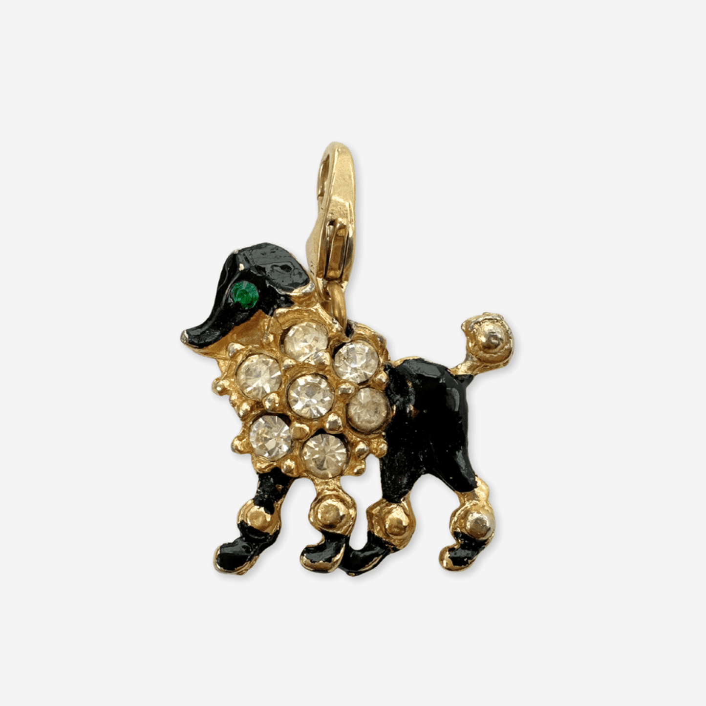 Vintage gold and black rhinestone poodle charm with green rhinestones and black enamel details on a raw brass clasp