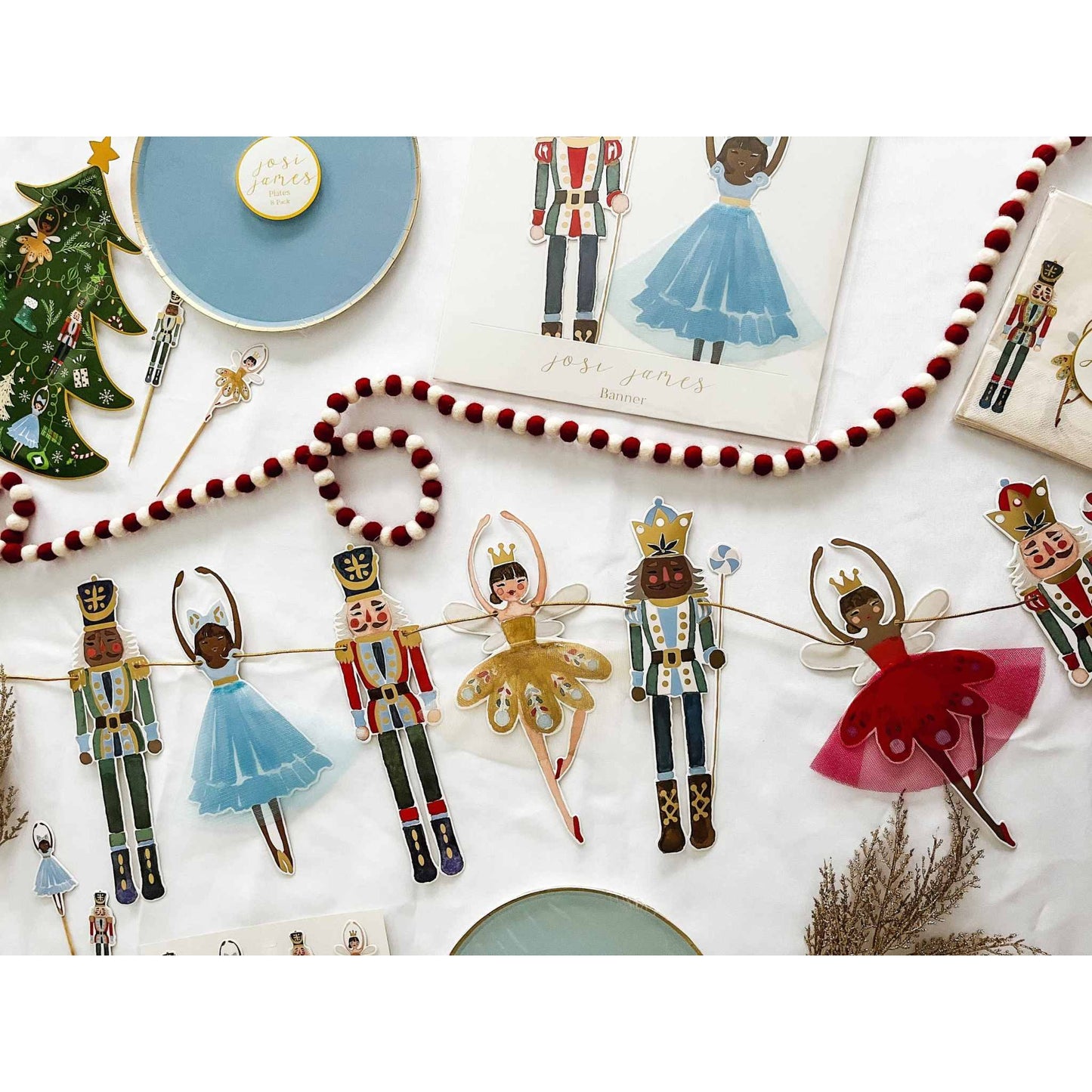 Nutcracker Christmas Banner with ballerinas and nutcracker figures on gold string with gold foil accents for holiday decoration