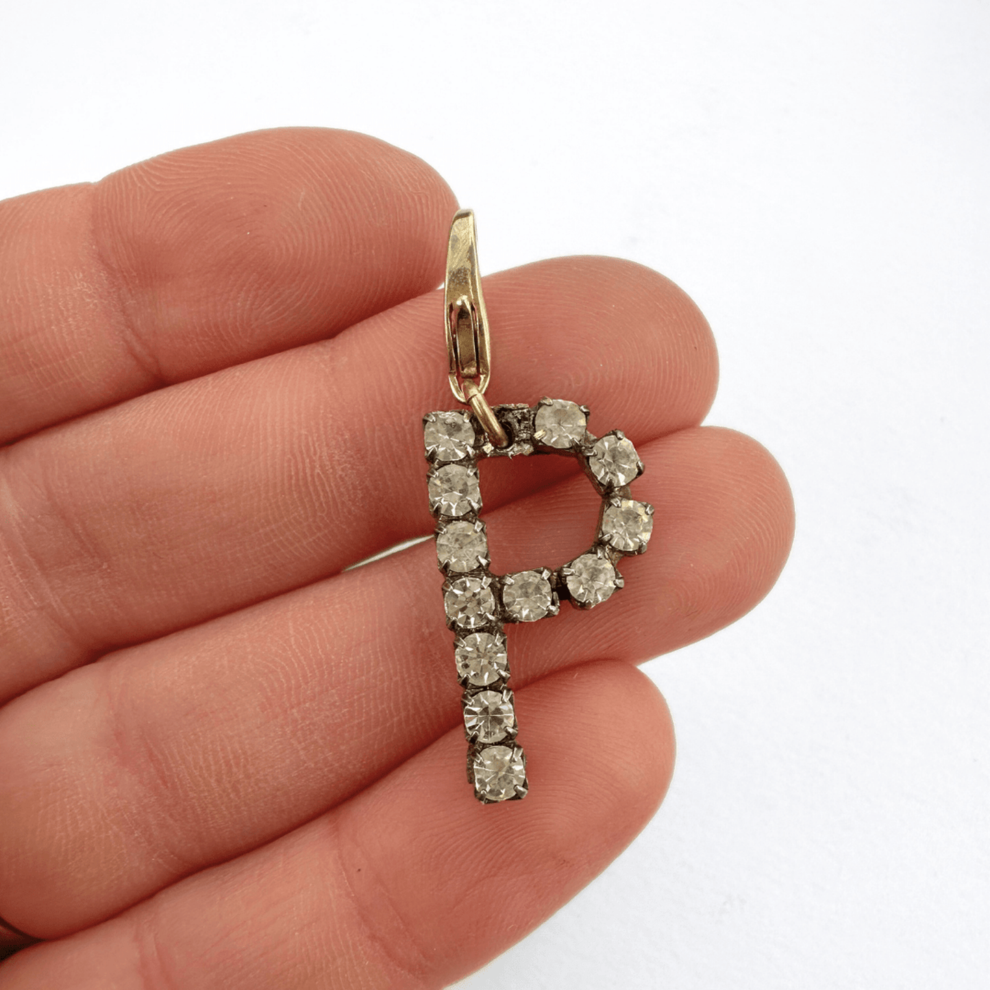 Vintage clear rhinestone "P" monogram charm with silver tone prong setting and raw brass lobster clasp
