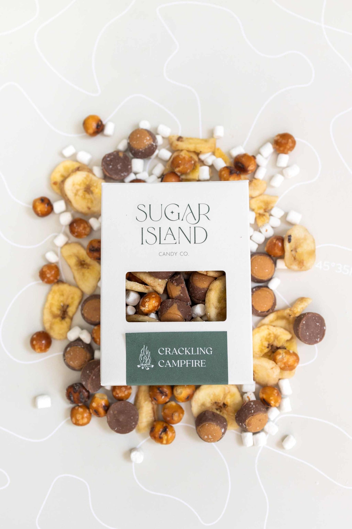 Crackling Campfire Candy mix with mini marshmallows, buckeyes, banana chips, and pretzel balls in Sugar Island box