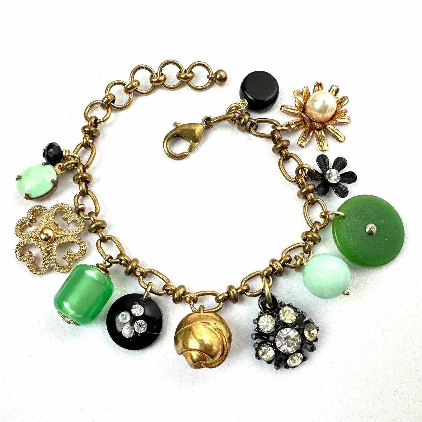 Repurposed vintage charm bracelet with buttons, beads, and rhinestones on adjustable brass chain