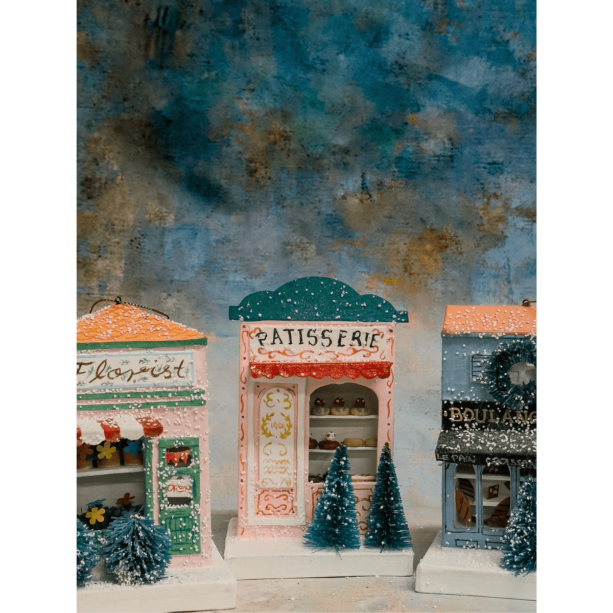 
                  
                    European Village Shop Christmas paper house ornaments including Florist Shop, Patisserie, and Boulangerie designs with holiday decorations
                  
                