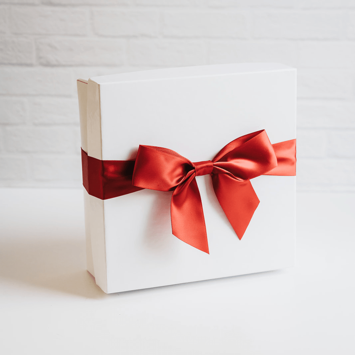 Deluxe white gift box with ivory crinkle paper and red satin ribbon bow set 8x8x3 inches