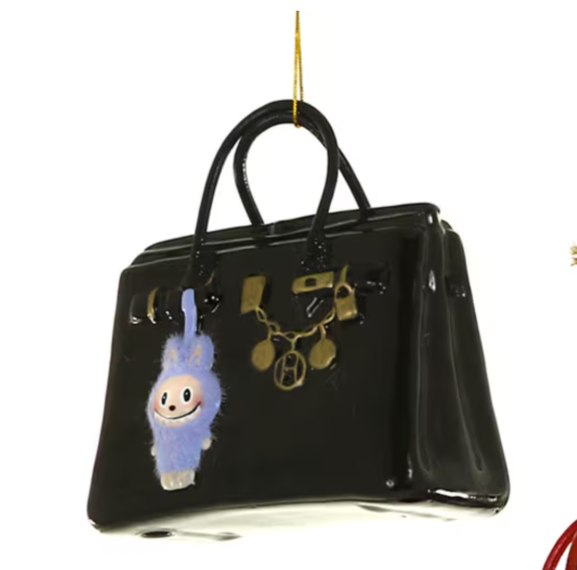 Christmas Carousel Collection 4.5" black glass luxe bag ornament with playful monster charm