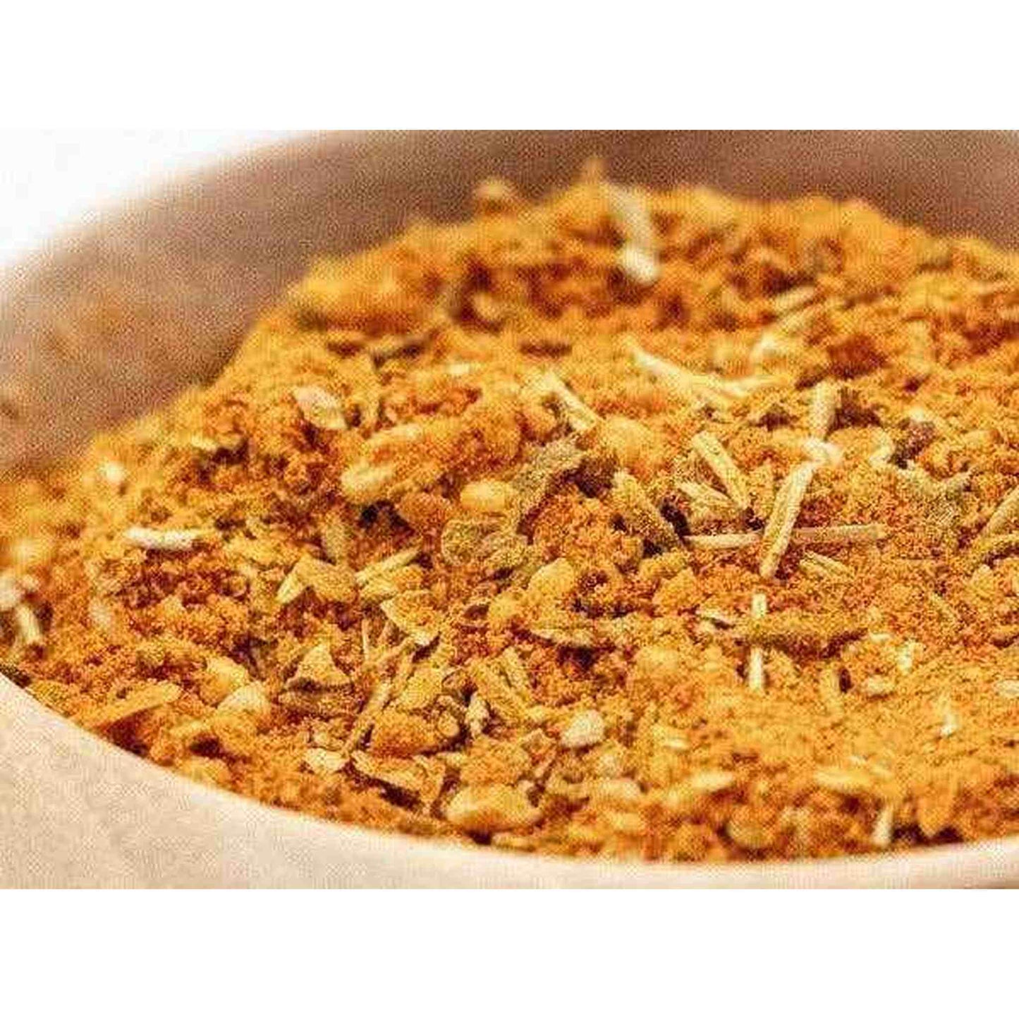 Close-up of Provencal blend spice mix with turmeric, paprika, garlic, herbs in bowl