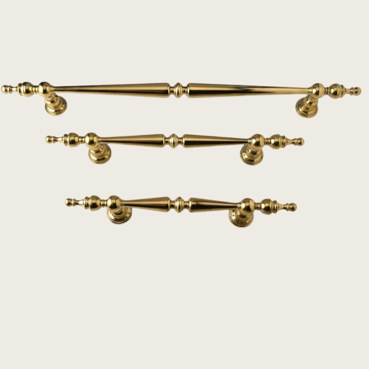 Classic brass spindle pull with turned posts and polished gold finish
