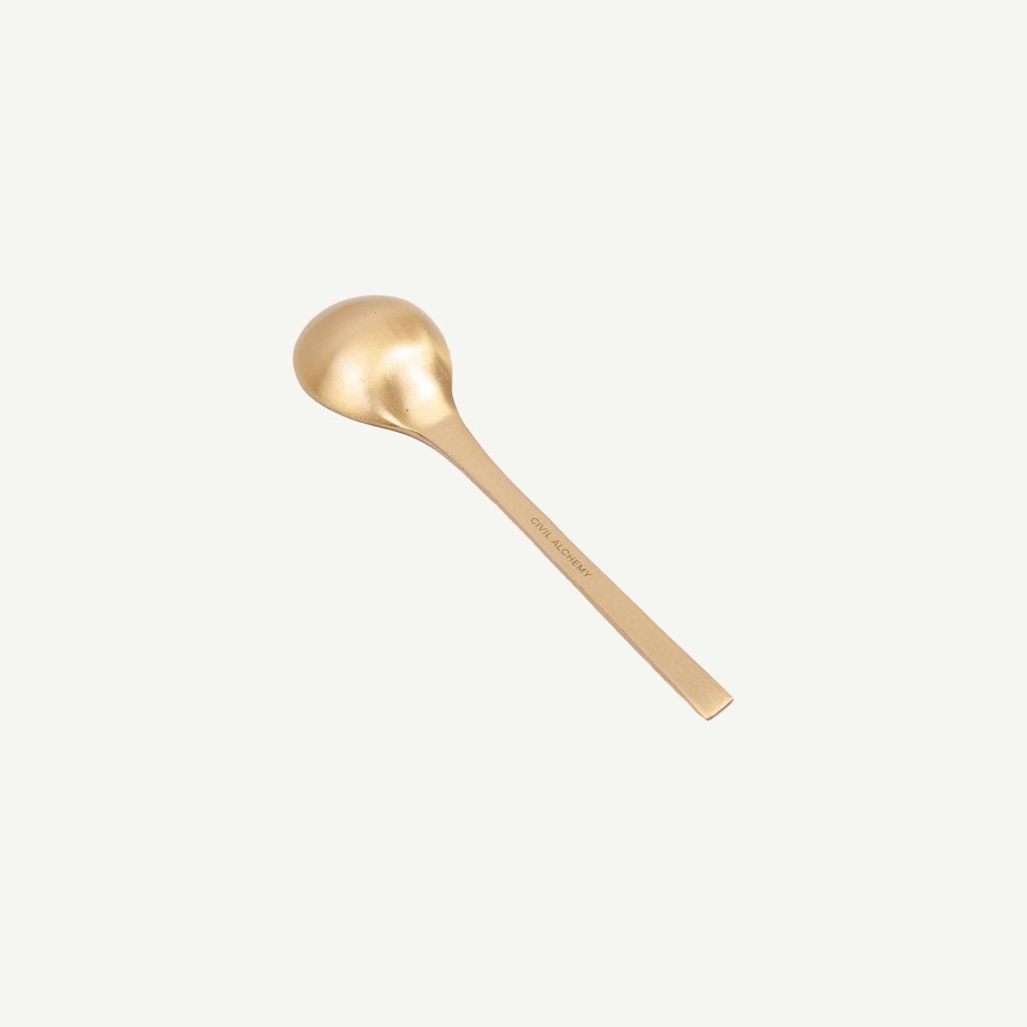 Solid brass spoon from Civil Alchemy’s durable serve-ware collection measuring 4.875” x 0.75”