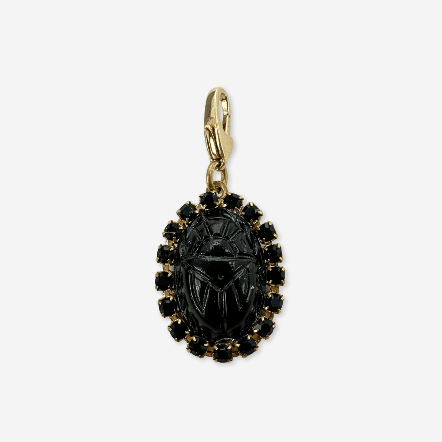 Vintage black glass oval scarab charm with rhinestone border and brass clasp