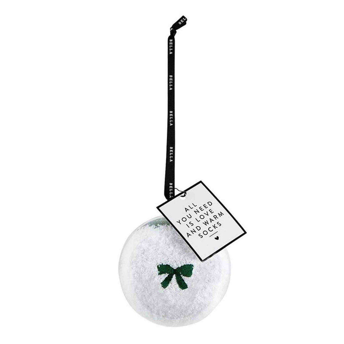 
                  
                    Cozy white socks with green bow in round ornament with hanging ribbon and tag
                  
                