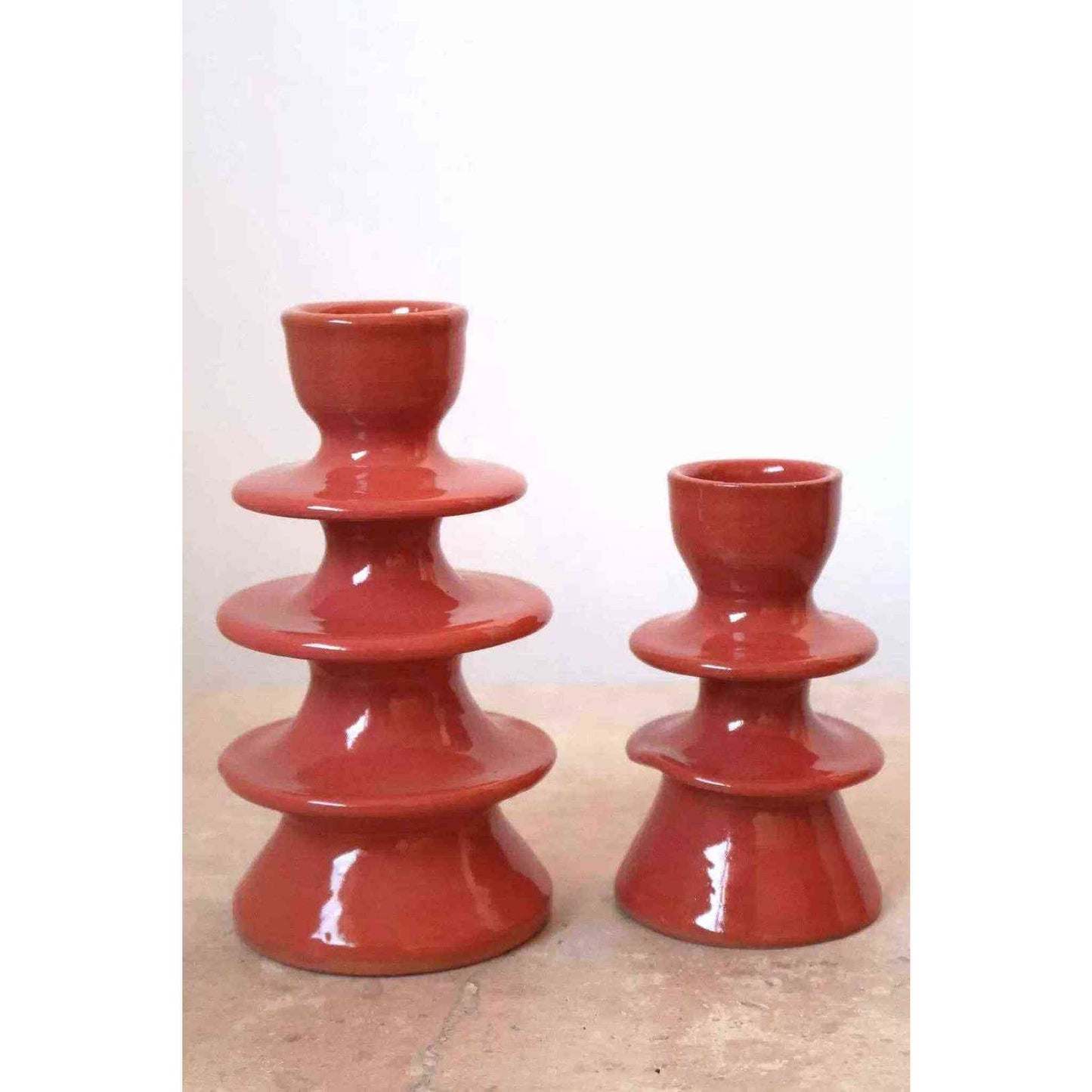 Handmade dark pink ceramic candle holders with glossy finish and unique artisanal design