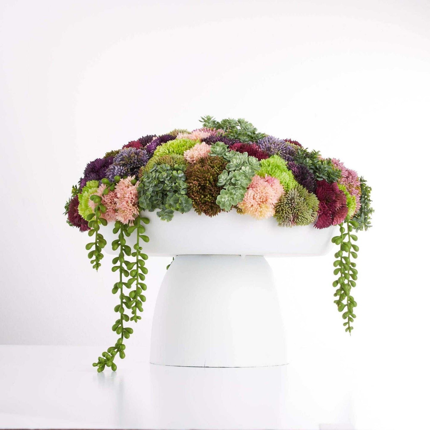 Elevate Sedum-Wide succulent arrangement in white metal vase with vibrant sedum clusters
