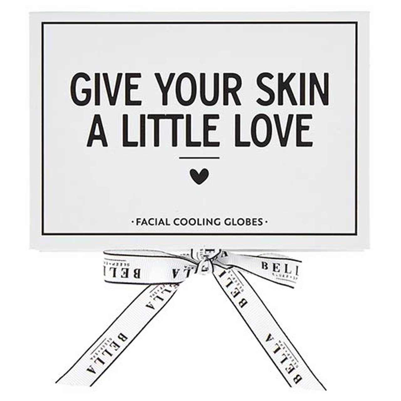 Cooling Eye Globes in red glass for reducing under-eye puffiness and refreshing skin.