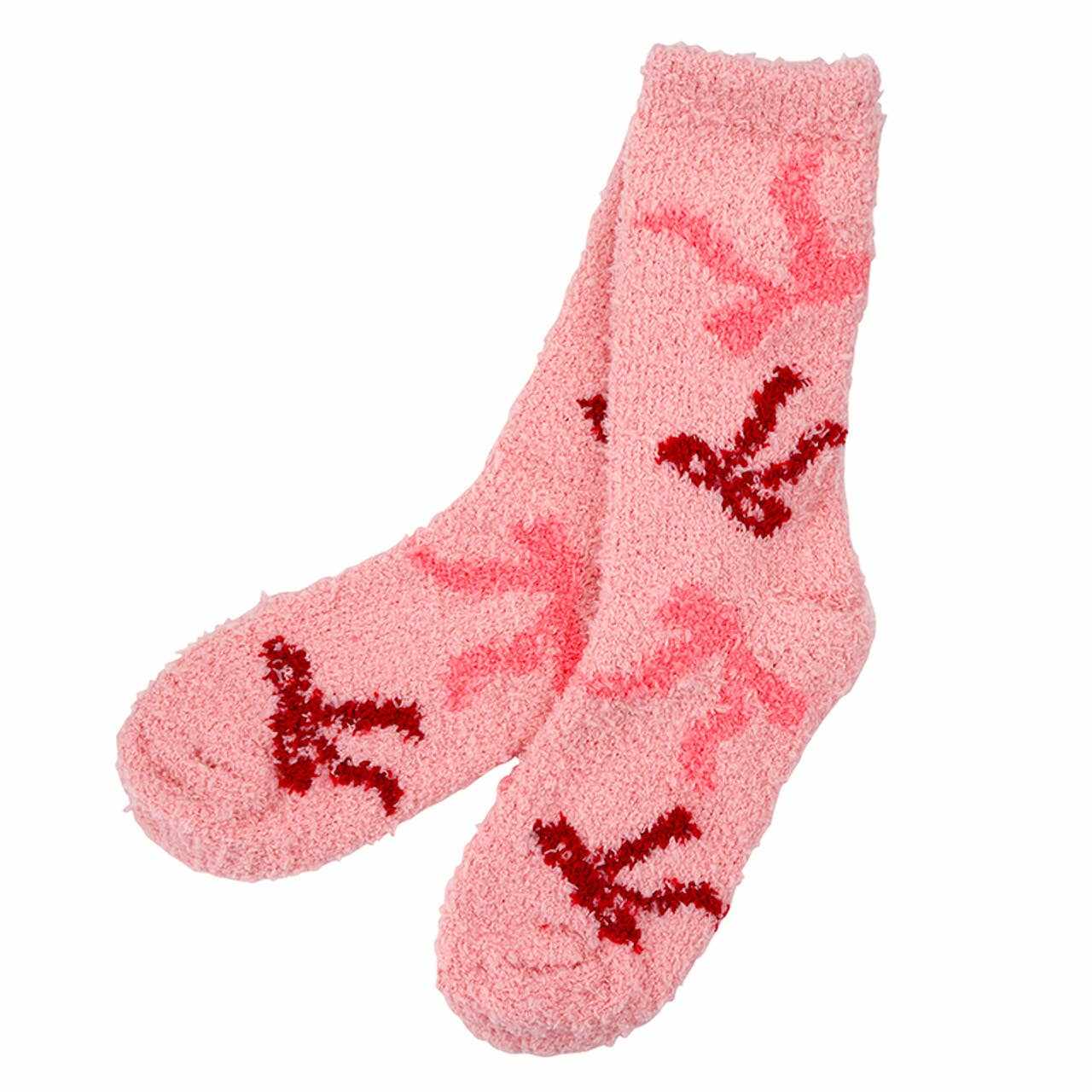 Blush pink cozy socks with ornament and bow design made of soft plush material