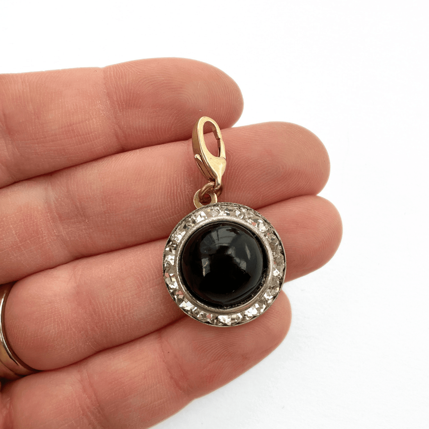 Vintage black and rhinestone button charm with brass clasp and black glass center
