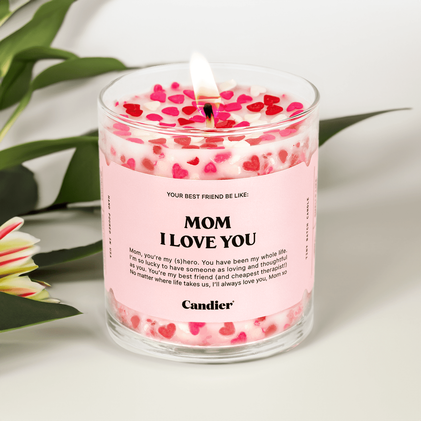 Hand-poured "Mom, Love You" soy candle in reusable glass jar with heart decorations and pink label, perfect gift for moms.