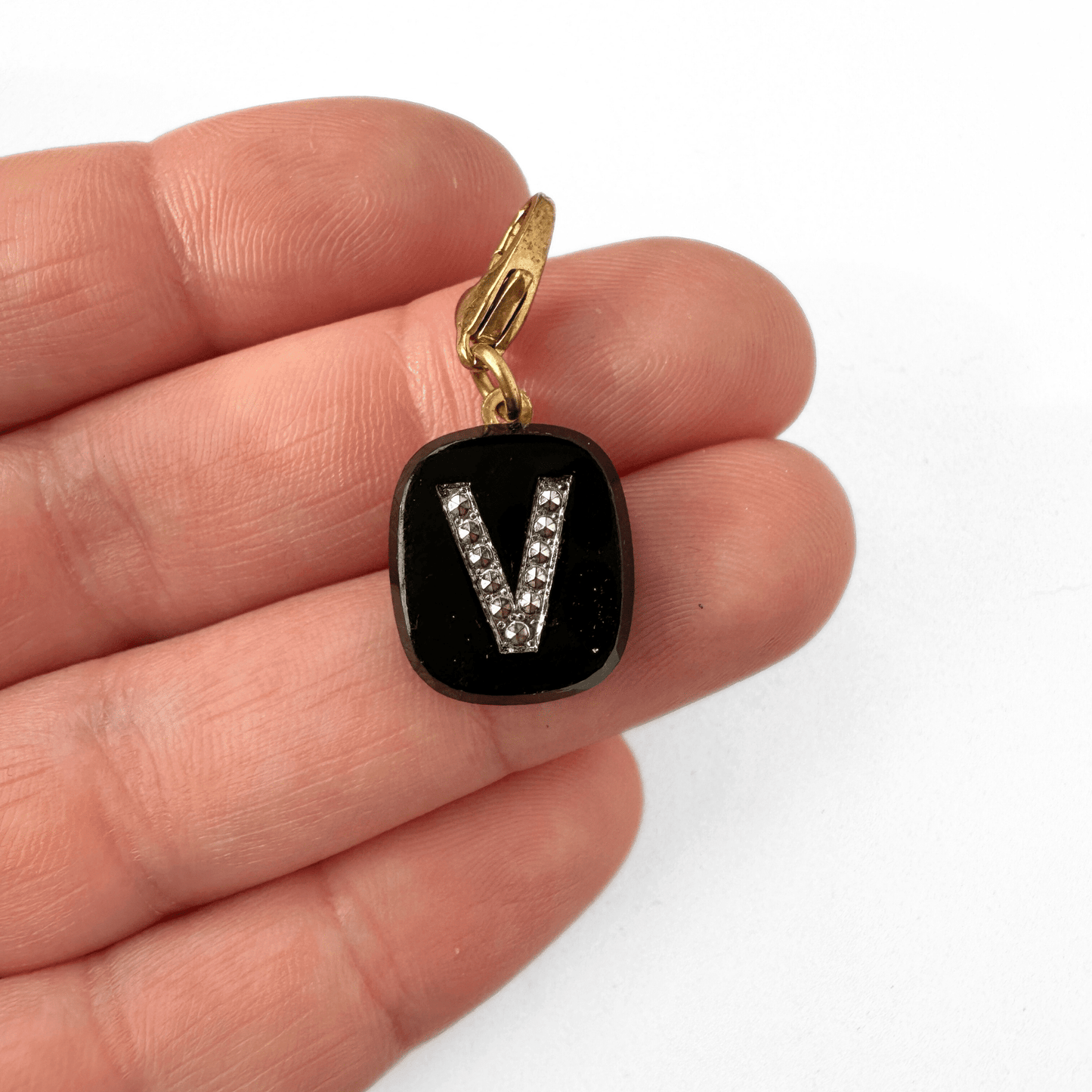 Vintage black glass letter V charm with silver marcasite and brass lobster clasp