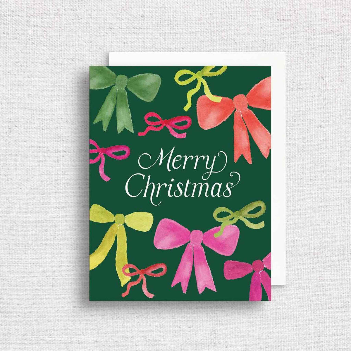 Merry Christmas greeting card with colorful hand-painted bows on dark green background