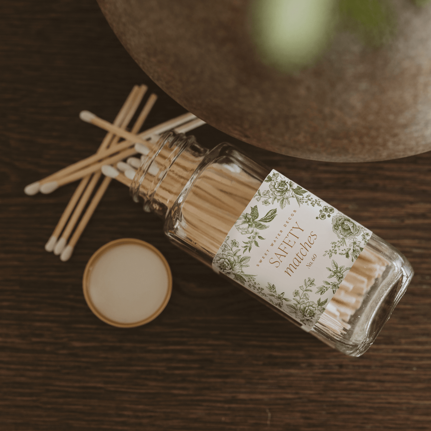 Green Delft White Tip safety matches in a glass jar with Delft-inspired label