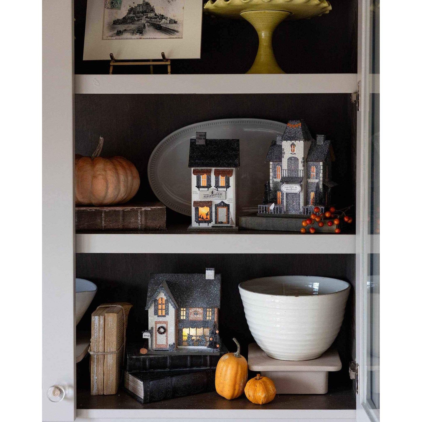 
                  
                    Battery-powered haunted village decor Dead & Breakfast house with spooky details and ghostly guests on a shelf display.
                  
                