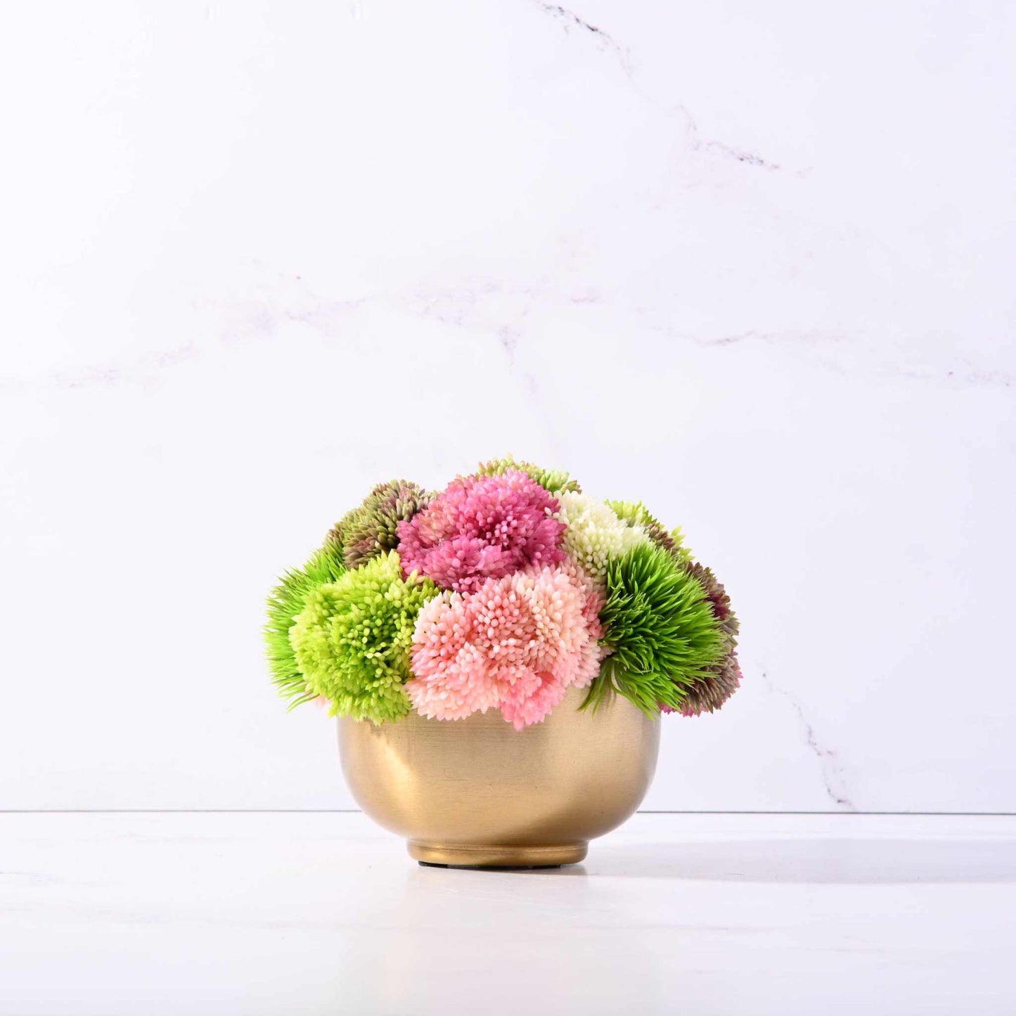 Mini Garden Bowl with bright sedums in a brushed gold small vase, perfect decorative accent.