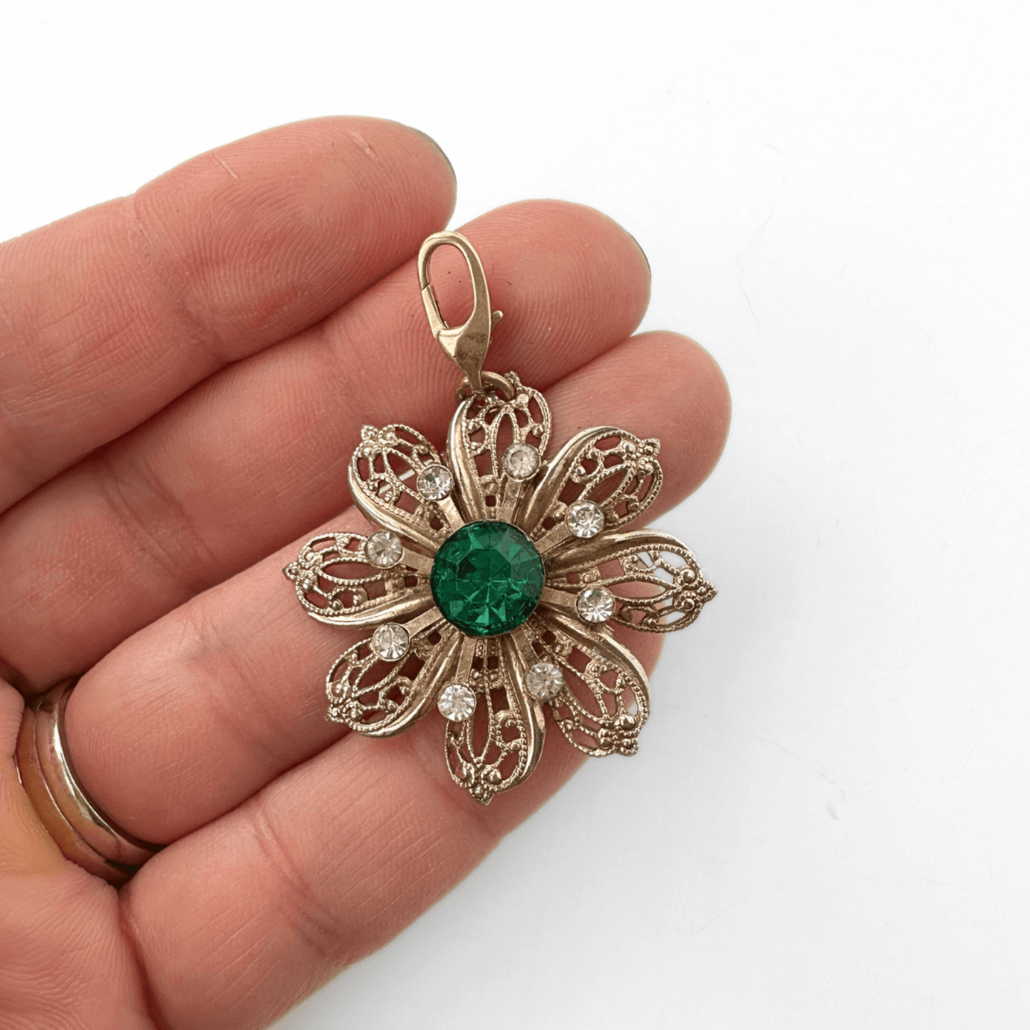 Vintage large brass filigree flower charm with green rhinestone center and lobster clasp