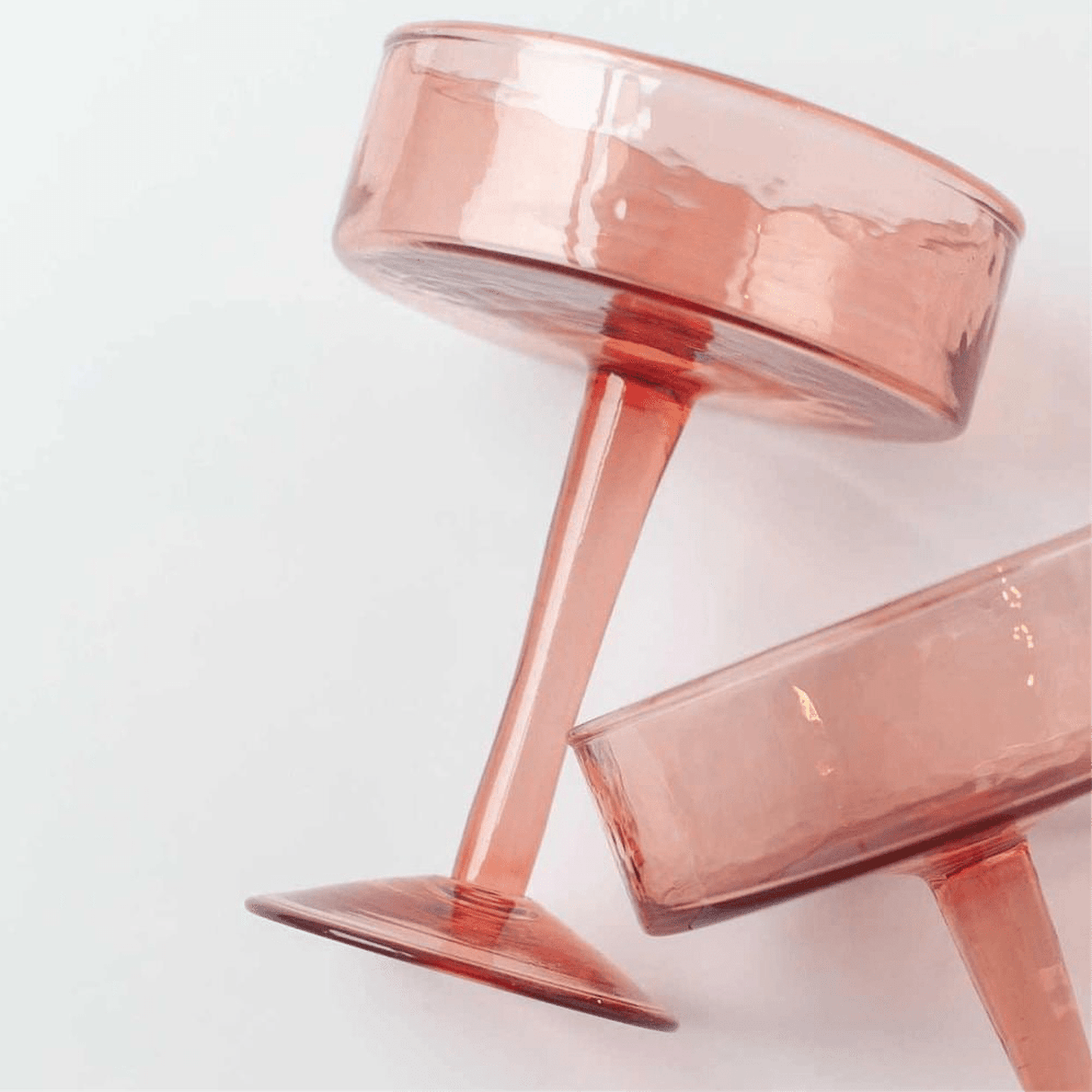 Blush handblown hammered coupe cocktail glass made from recycled glass