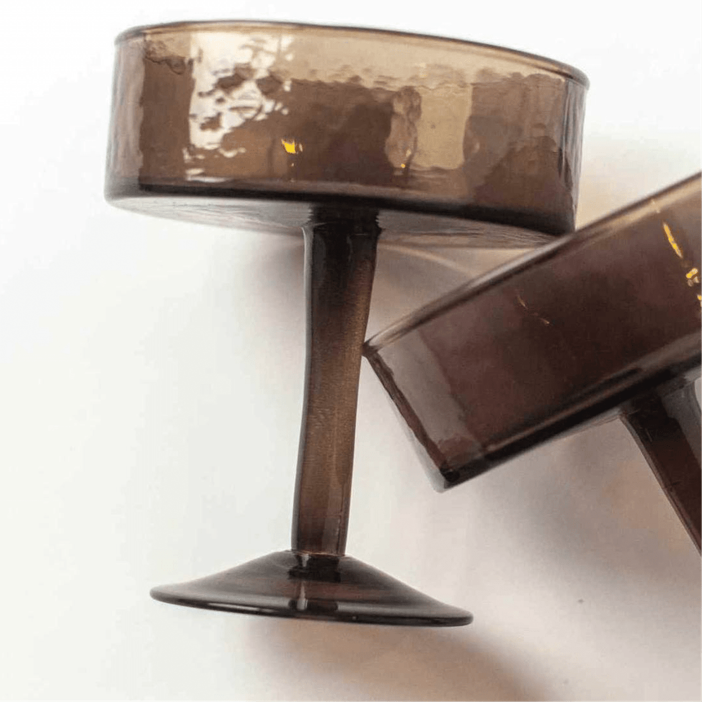 Smoke grey handblown hammered coupe cocktail glass made from recycled glass