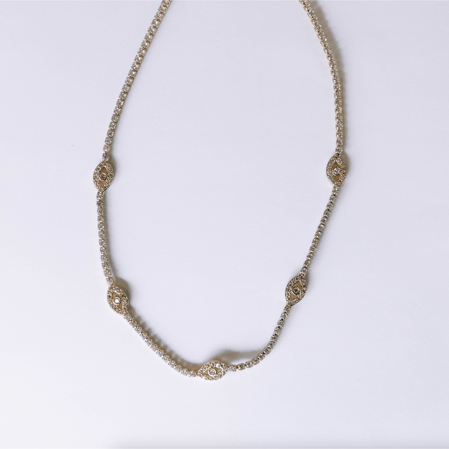 The Sparkling Eyes Choker 24k gold-filled tennis chain necklace with CZ stones and lobster clasp closure