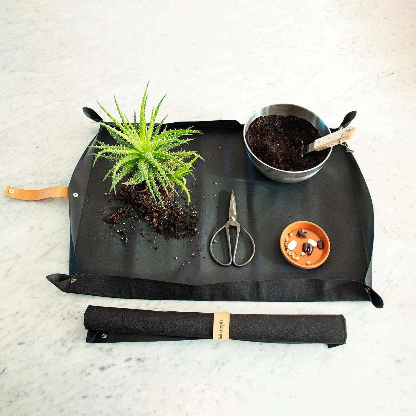 
                  
                    Potting tarp for urban gardening: Vegan black ribbon - Curated Home Decor
                  
                