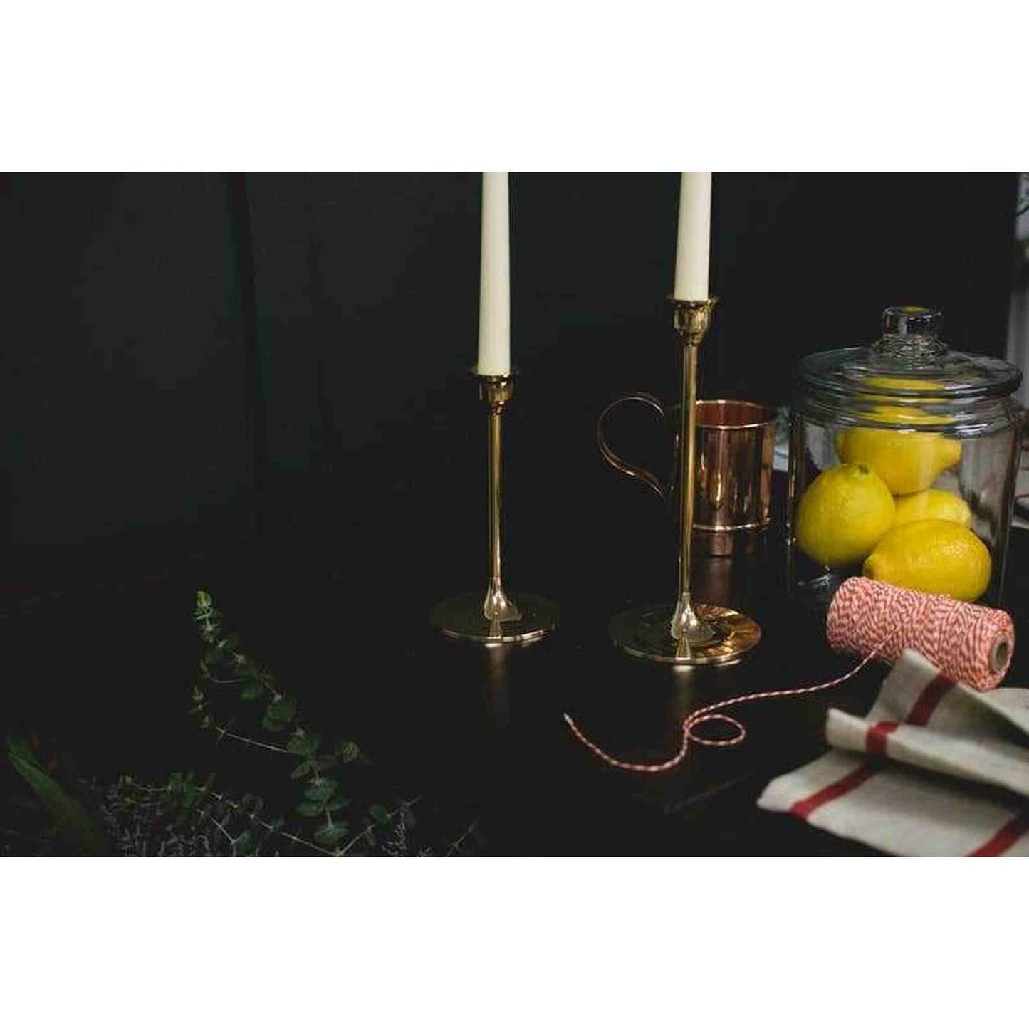 
                  
                    A set of three brass candlesticks. - Curated Home Decor
                  
                
