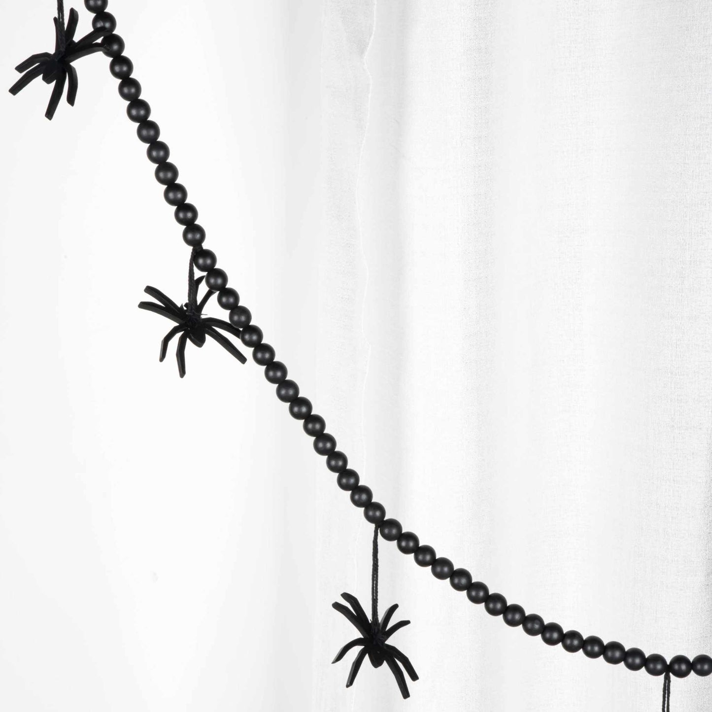 Black Halloween Garland with beaded strand and spider accents for indoor decoration