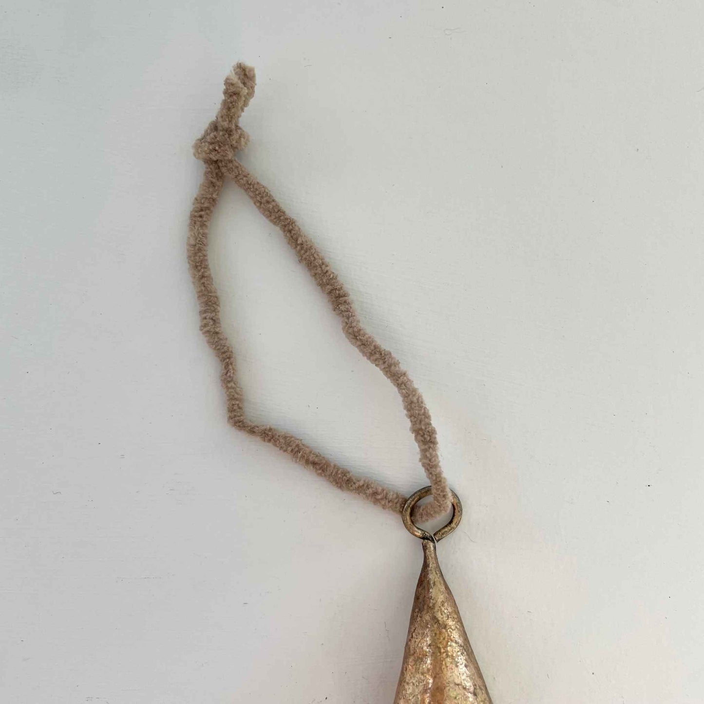 2" cone tin bell with brass finish and tan suede-like cord holiday ornament