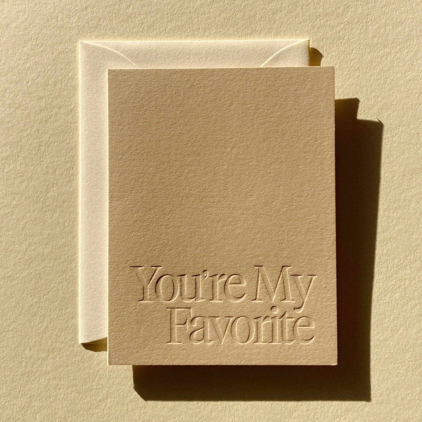 A2 folded "You're My Favorite" card with blind deboss text and natural envelope, blank interior, stone color, made in Los Angeles
