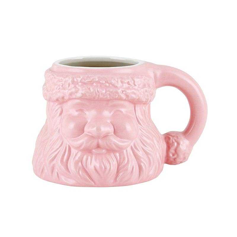Pink ceramic shaped mug with Santa face design, holiday-themed drinkware